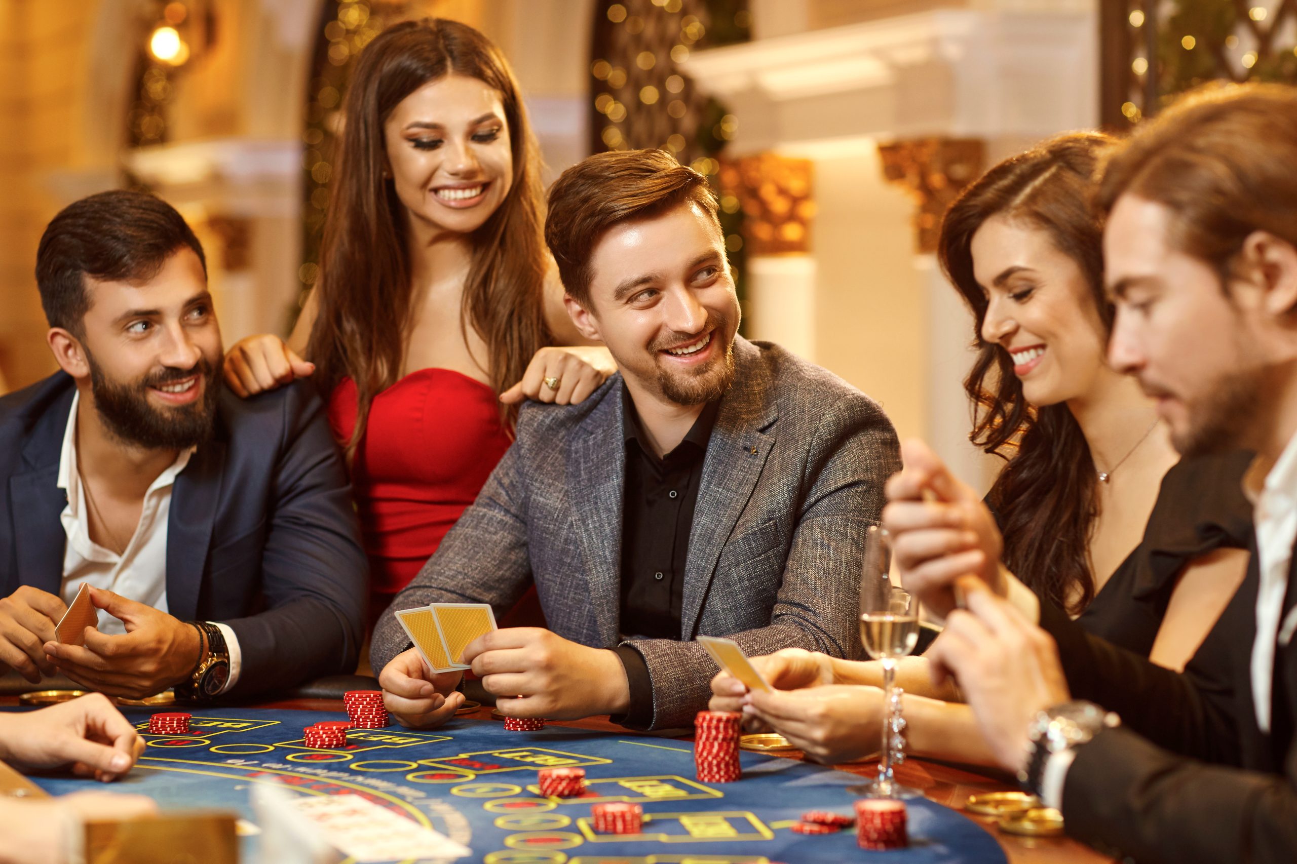A group of people playing gambling in a casino